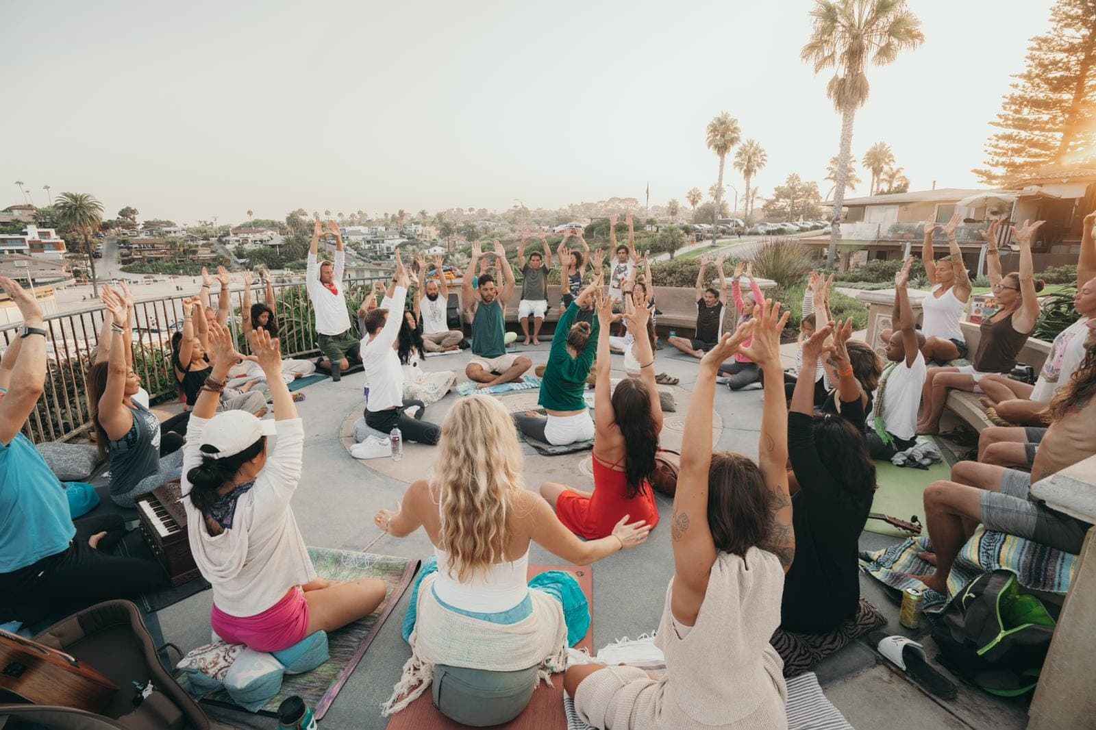 A Circle sitting together for breathwork outdoors
